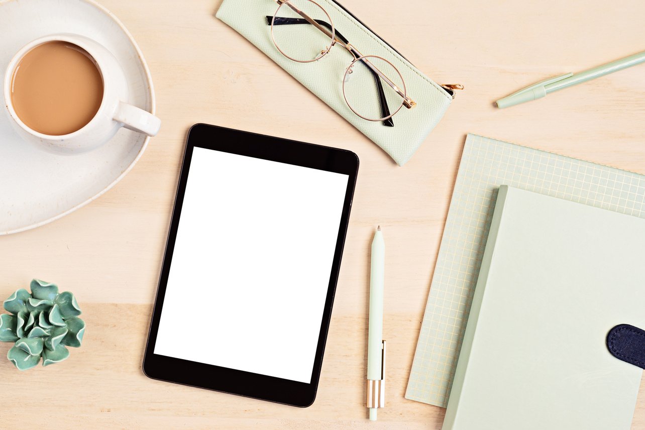 Tablet and Stationery on a Wooden Workspace          